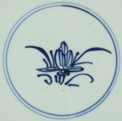 2011340 Symbol mark: Lotus. Symbol of purity and one of the eight Buddhist Emblems, in a double circle, underglaze blue.